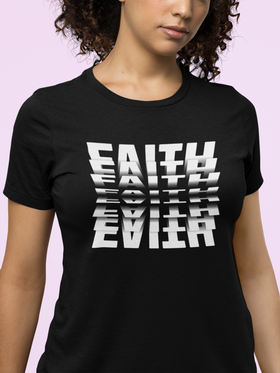 Black t-shirt with 'FAITH ETERNAL' text design worn by a person on a pink background